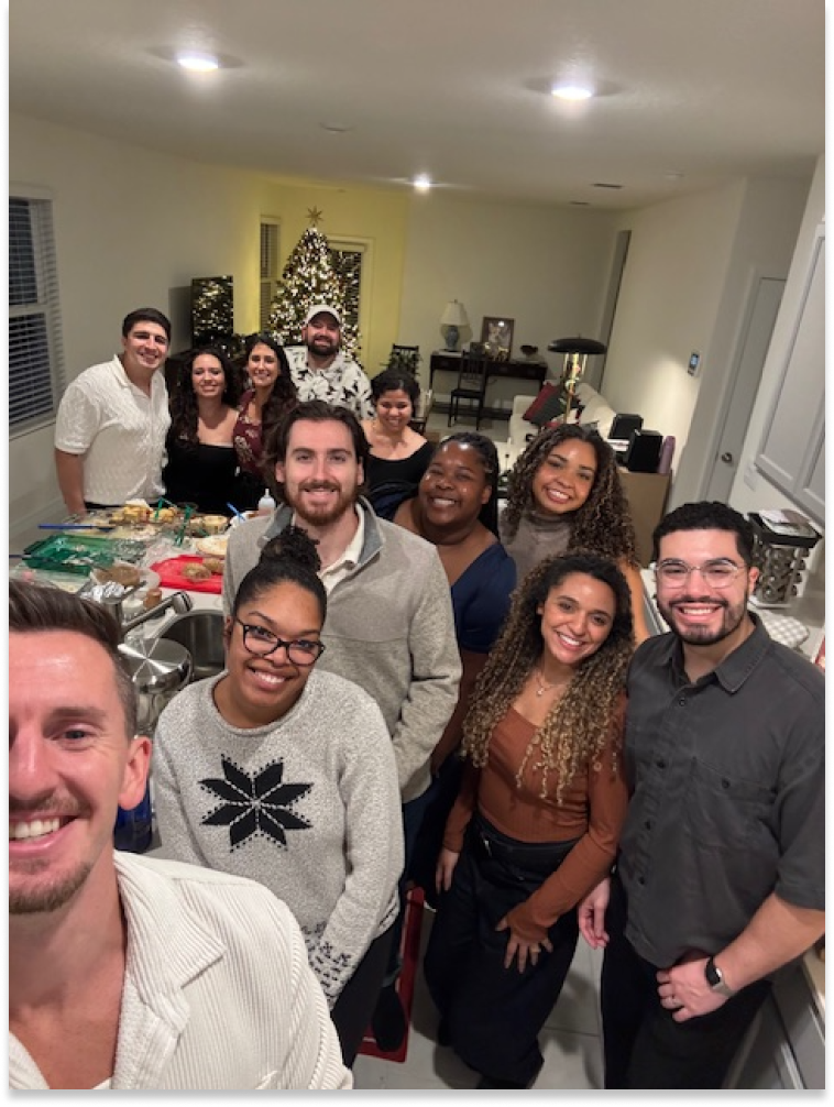 Zach with his team at a holiday party